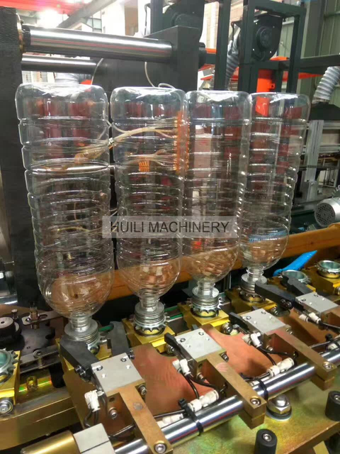 أحدث حار بيع كامل التلقائي 4 تجويف 2 لتر زجاجة عصير PET ضربة صب الإله